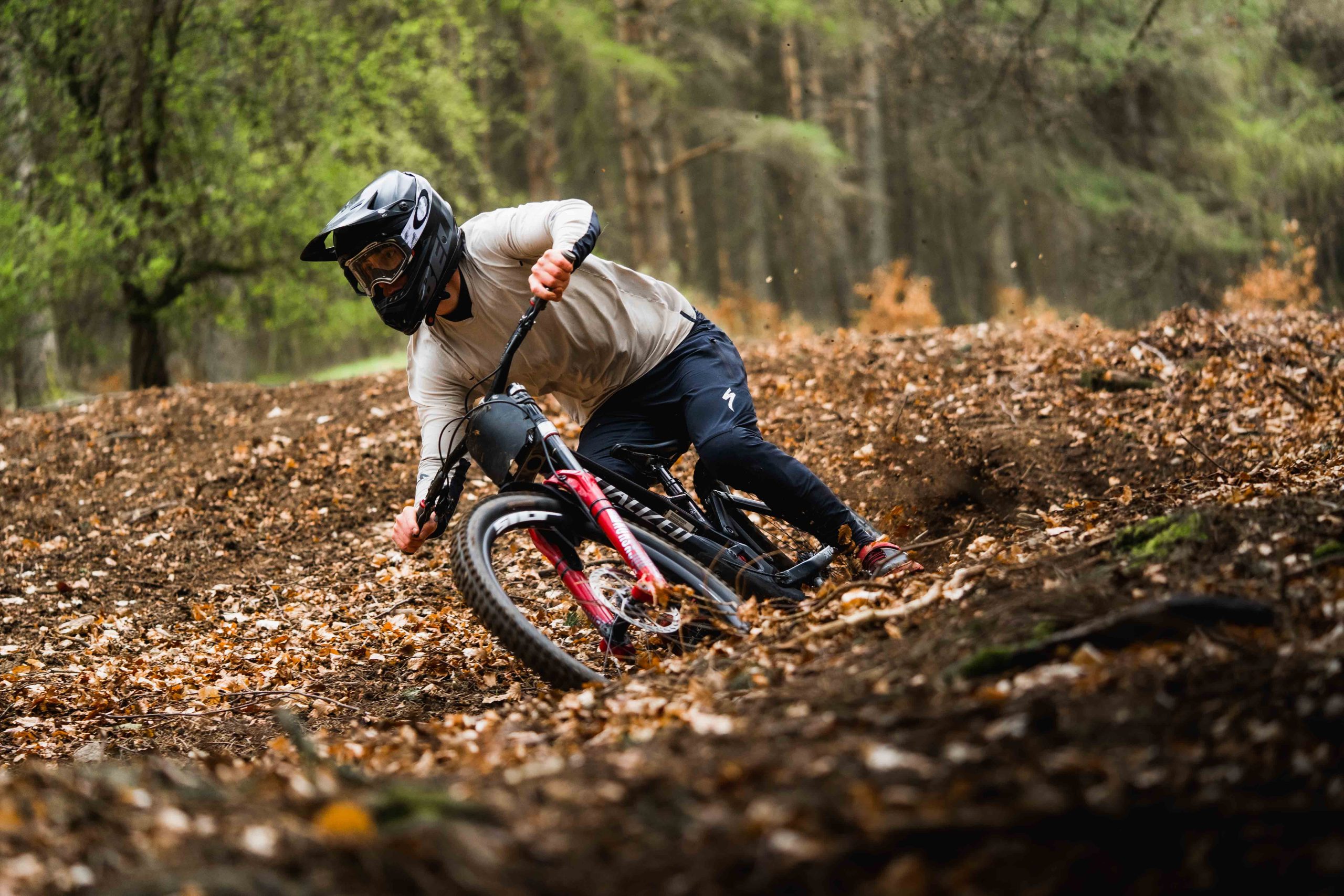 A professional mountain biker rides down a hill side in Biggar Scotland 1 scaled New head impact technology to help tackle concussions in sport