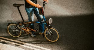 Brompton 50 bike plus person on street Brompton releases special 50th anniversary bike inspired by its master crafters