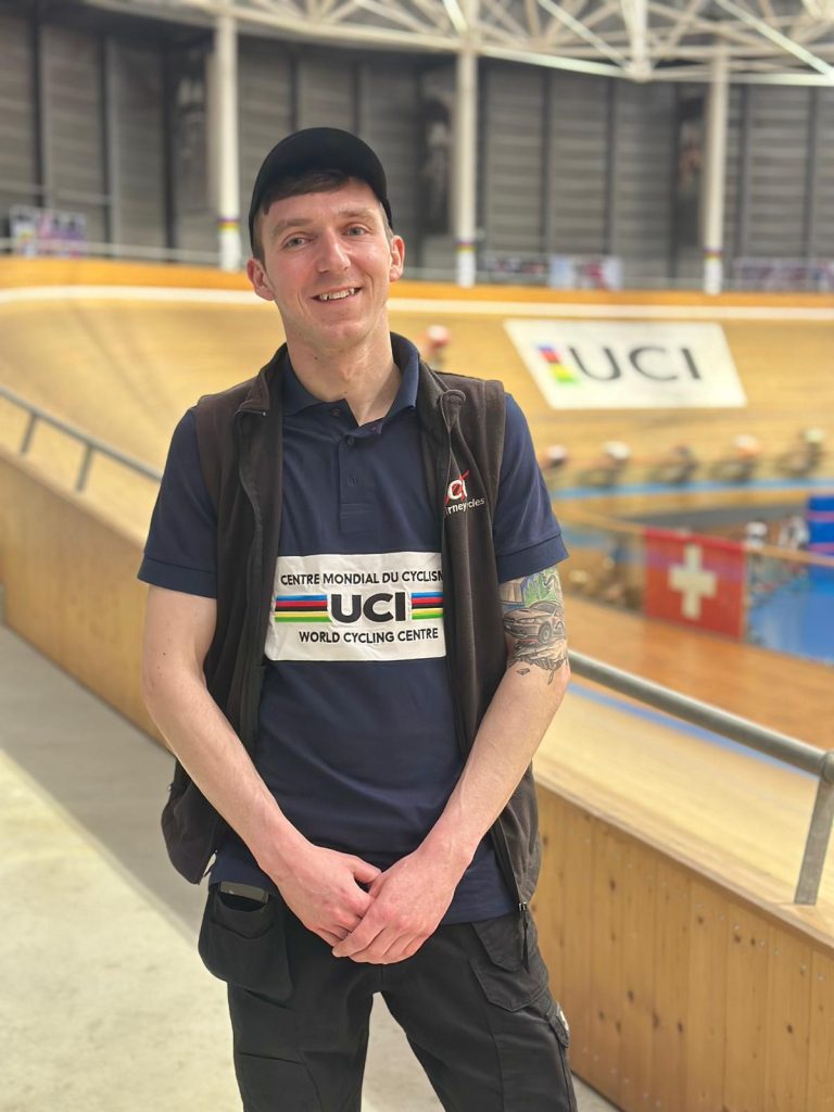 Connor Mooney at UCI training, posing nex to the velodrome