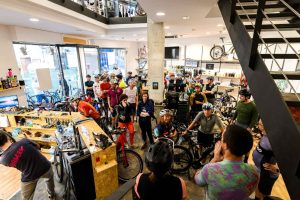 Eat Sleep Cycle Malaga hub with crowd in store Eat Sleep Cycle talk business success in challenging trading conditions
