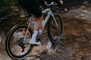 FKT on bike crossing river Parcours launch 'FKT' aero gravel wheelset