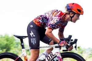 Human Powered Health brand collab on bike shot Human Powered Health showcase unique TdF Femmes avec Zwift kit collab