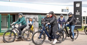 Moustache staff riding bikes outside factory Moustache wins award for encouraging and supporting staff cycling uptake
