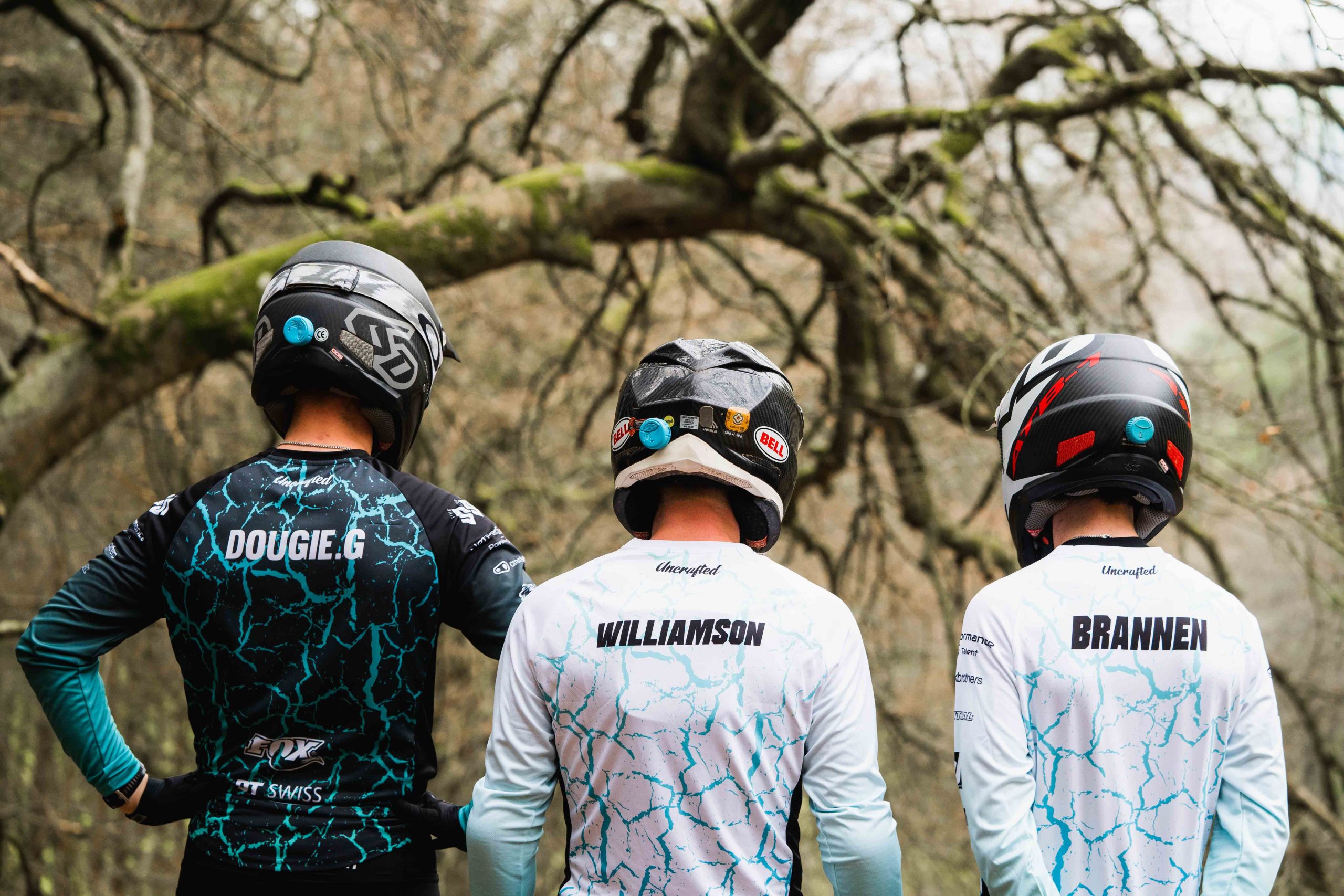 Three professional mountain bikers demonstrate HITs concussion monitoring device on their helmets scaled New head impact technology to help tackle concussions in sport